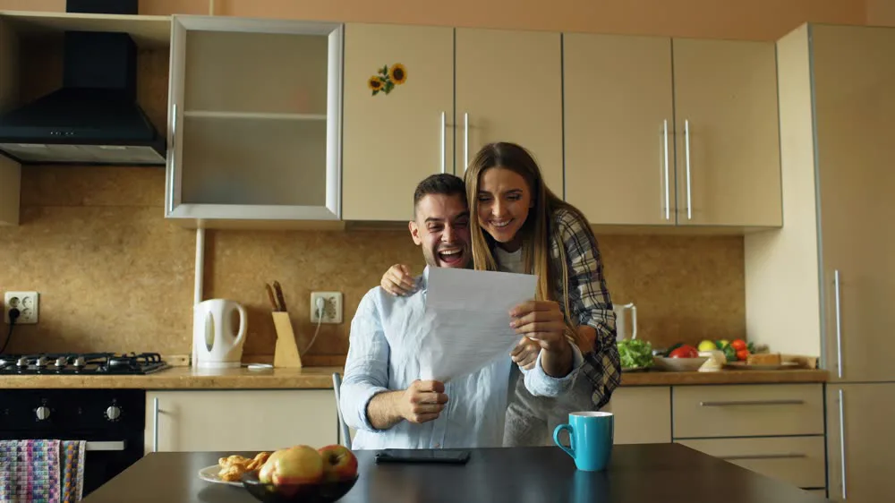 Homeowner reviewing paperwork to refinance a UAE mortgage