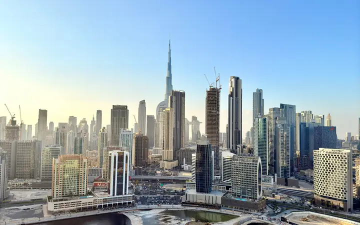 Dubai skyline with the Burj Khalifa above Business Bay residential towers on a clear day
